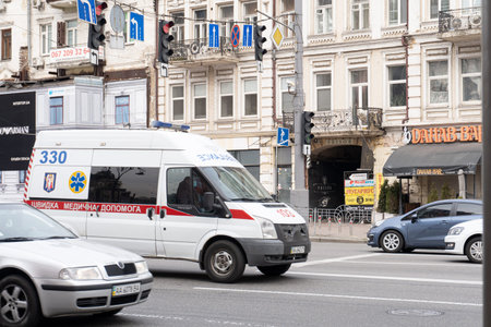 Kiev, Ukraine, March 27, 2020, emergency ambulance on street road, the period of coronavirus pandemia, protective measuresのeditorial素材