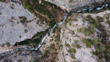 High air view from drone at strong fast river and wooden path among high rocks. Turkey, canyon.の写真素材
