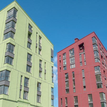 kind of a new multistorey brick residential building on a sunny dayの写真素材