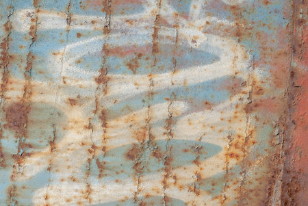 fragment of an iron surface is covered with color paint, which has long been under the influence of...