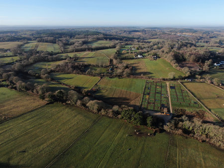 aerial view of fields and hedgerows and allotments on a sunny day
