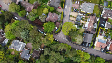 Aerial view of some large detached houses set amongst woodlandの写真素材