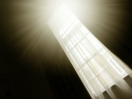semi-abstract picture of long tall window with sunlight streaming in