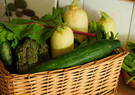A wicker basket full of healthy organic vegetablesの写真素材