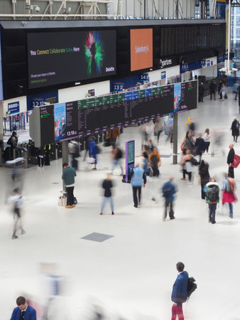 Passengers at Waterloo railway terminus in London UKのeditorial素材