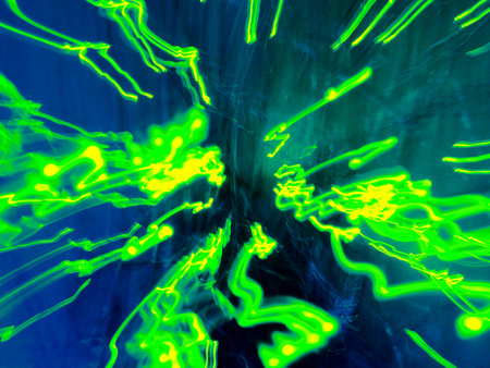 Abstract green light streaks against a dark backgroundの写真素材