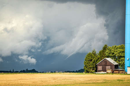 Dark storm clouds cumulonimbus from a supercell thunderstorm during a severe weather outbreakの写真素材
