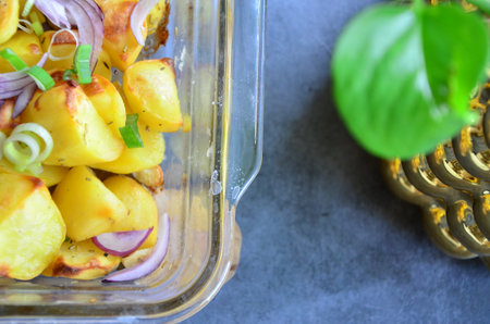Baked potatoes with onions and herbs. Selective focus. nature.の写真素材