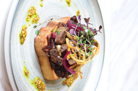 sendwitch with grilled liver, served in a restaurant as a beautiful modern appetizer, street food cuisineの写真素材