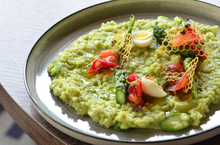 beautiful food background, green creamy asparagus risotto, serving in restaurant. decoratedの写真素材