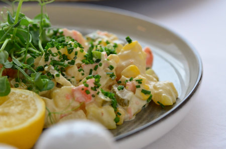 Salad with crab sticks, lemon and herbsの写真素材