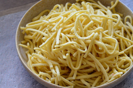 Noodles in a bowl on the table. Close-up.