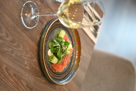Salmon tartare with avocado and arugula served in restaurantの写真素材