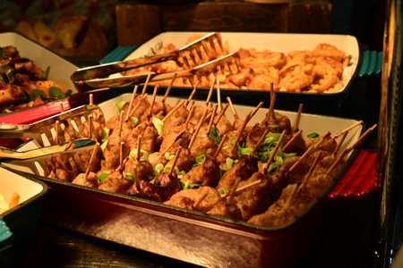 Close up of Thai style grilled chicken on the street food market.の写真素材