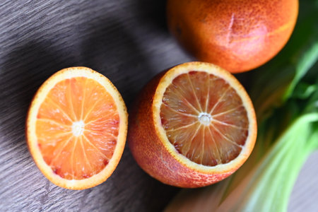 Close up of a slice of orange on a gray background with copy spaceの写真素材