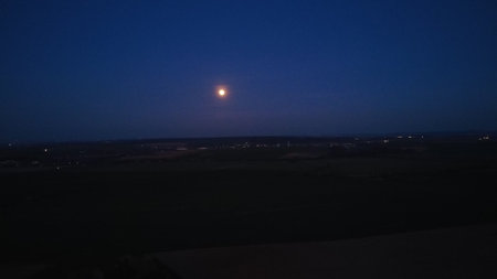 Night landscape with a full moon in the sky. View from above.の写真素材