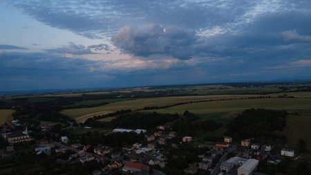 Aerial view of the village in the evening with cloudy sky.の写真素材