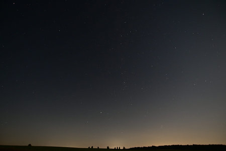 Night sky with stars and milky way. Long exposure photograph.