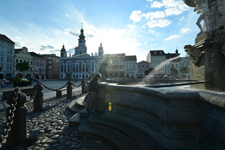 The Fountain of Neptune located at the historic town square of ÄeskÃ© BudÄjovice, Czech Republic, showcasing Baroque architecture and vibrant city atmosphere.の写真素材