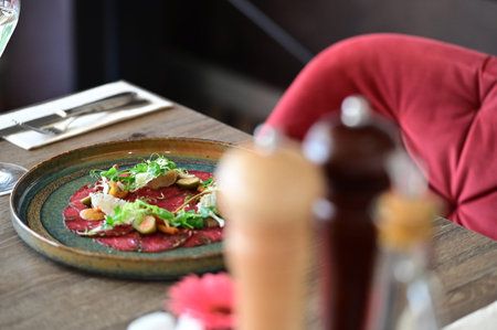 Beetroot carpaccio served with parmesan and saladの写真素材