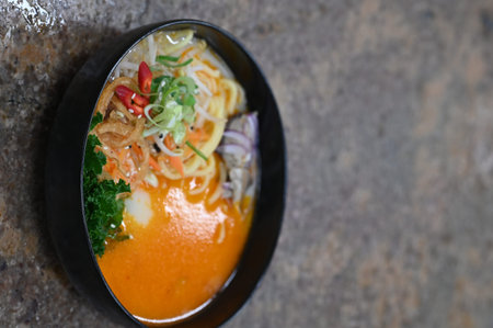 Tom Yum Goong, Thai noodle soup in black bowl