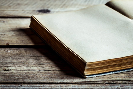 Book on wooden background, reading, old book, secret book, one bookの写真素材