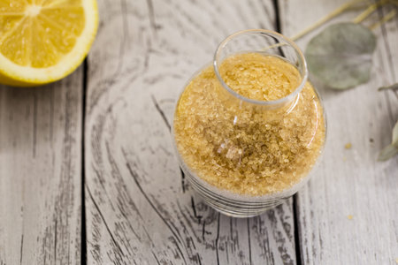 beautiful composition with lemon, lemonade , cane sugar on wooden background