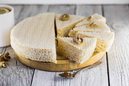 waffle cake on white wooden background with teaの写真素材