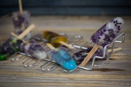 fresh frozen colored ice cream on wooden background
