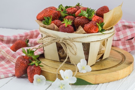fresh berries, strawberries in basket on white background, foodの写真素材