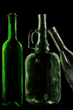 glass bottle, empty, original, on black background space for textの写真素材