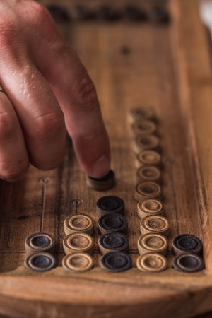 wooden Board with backgammon, pawns with dice, close upの写真素材