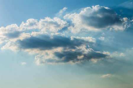 beautiful blue sky, the sun's rays cut through the cloud