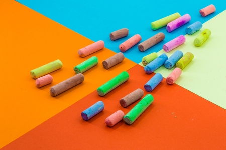 colored crayons on a background of colored paper, schoolの写真素材