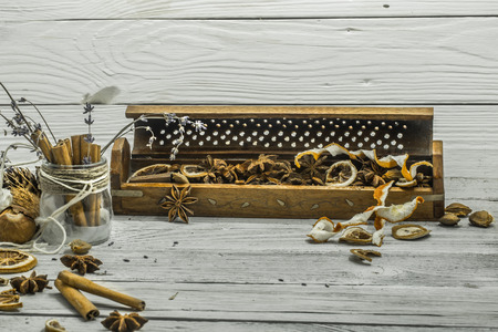 beautiful white wood background, cinnamon sticks, star anise,lemon, winter, autumn close-upの写真素材