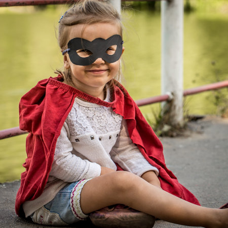 beautiful little girl in the image of a super heroの写真素材