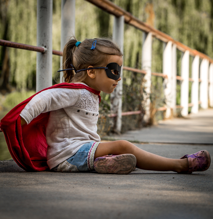 beautiful little girl in the image of a super heroの写真素材