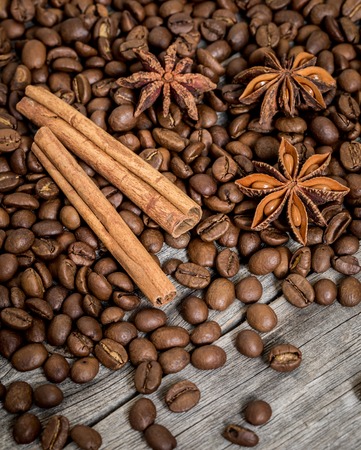 Spilled coffee, cinnamon and Damian on wooden backgroundの写真素材