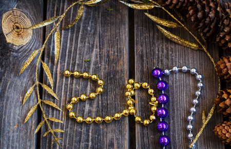 new year 2017, wooden toys with beads and cones on wooden backgroundの写真素材