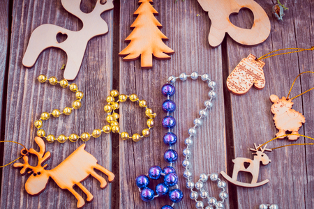 new year 2017, wooden toys with beads and cones on wooden backgroundの写真素材