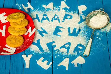 text happy new year on the beautiful blue wood background