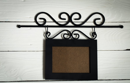 Beautiful black hanging photo frame,place for text on white background