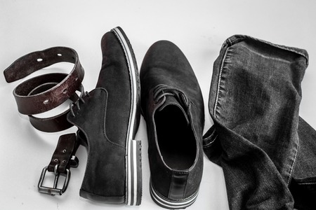 Set of mens clothing jeans, shoes,belt, on a white backgroundの写真素材