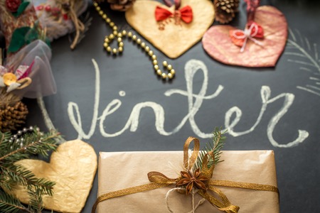 Chalk inscription winter on black chalkboard with Christmas holiday decor, toys ,holidaysの写真素材