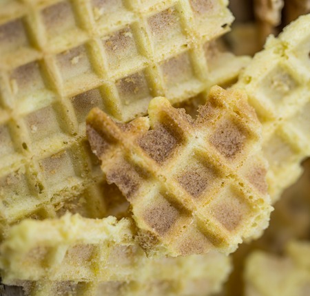 Waffles closeup,texture waffle,pieces waffle on a wooden backgroundの写真素材