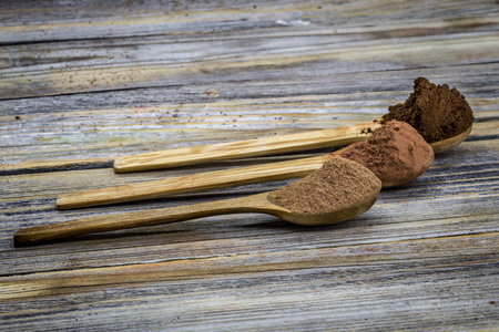 set of wooden spoon with coffee ,cocoa beautifully arranged on wooden background