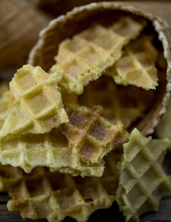 Waffles closeup,texture waffle,pieces waffle on a wooden background