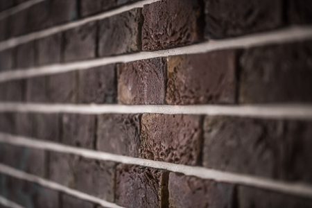 Beautiful brick wall, dark brown closeup ,backgroundの写真素材