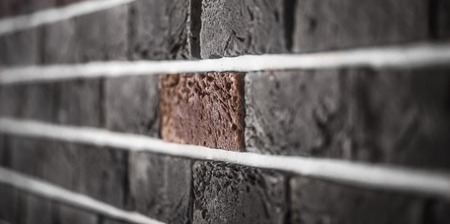 Beautiful brick wall, dark brown closeup ,backgroundの写真素材