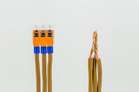 connecting electrical cables to the terminal block isolated on white background, closeupの写真素材